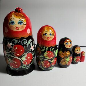 Matryoshkas Russian nesting dolls hand painted with Lady bug